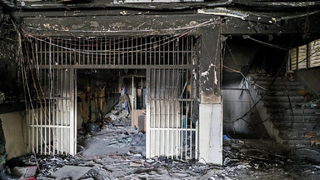Flames and thick smoke rising from Tehran’s Evin Prison had been widely visible on October 15 night. In online videos, gunshots and explosions could be heard in the area of the prison. The blaze was extinguished after several hours and no detainees escaped, state media said. (Image: AFP)