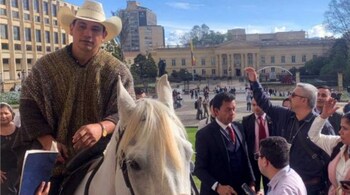 Colombian senator Alirio Barrera arrives with his horse to the Congress in Bogota.