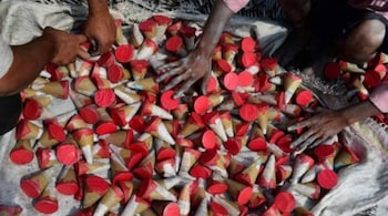 Workers lay out firecrackers for drying at a workshop ahead of Diwali. (Representative image)
