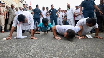 While Karnataka unit chief DK Shivakumar and the child are seen performing half push-ups, only Rahul Gandhi stood out as the one performing it correctly. (Image credit: @rssurjewala/Twitter)