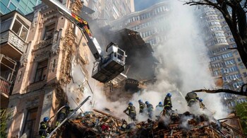 Firefighters work after a drone attack on buildings in Kyiv, Ukraine.