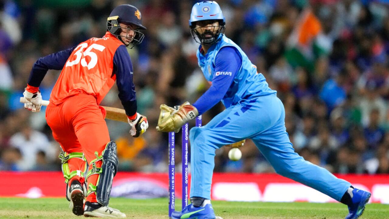 Netherlands' Scott Edwards, left, watches the ball go past wicketkeeper Dinesh Karthik during the T20 World Cup cricket match between India and the Netherlands in Sydney, Australia, Thursday.