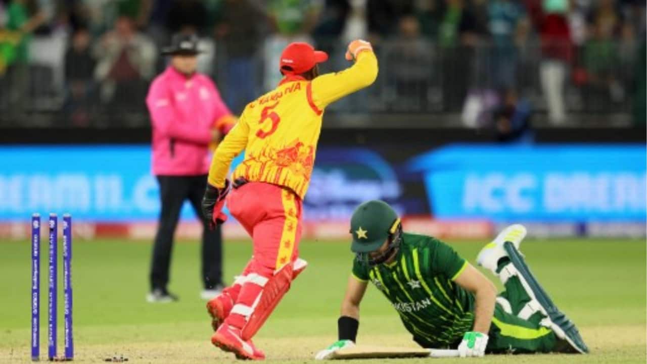Zimbabwe's Regis Chakabva (L) celebrates the victory as Pakistan's Shaheen Shah Afridi lies on the pitch at the end of the ICC men’s Twenty20 World Cup 2022 cricket match between Pakistan and Zimbabwe in Perth on October 27.
