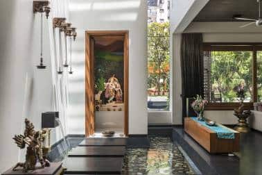 The puja ghar at the Skewed House, a part of - yet standing apart from - the earthly activities. Though part of an expansive living space, it gets its own identity as a soaring tower block standing within a kund.