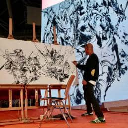 Kim Jung Gi at work on stage, a performance artist (Photo: Twitter) 
