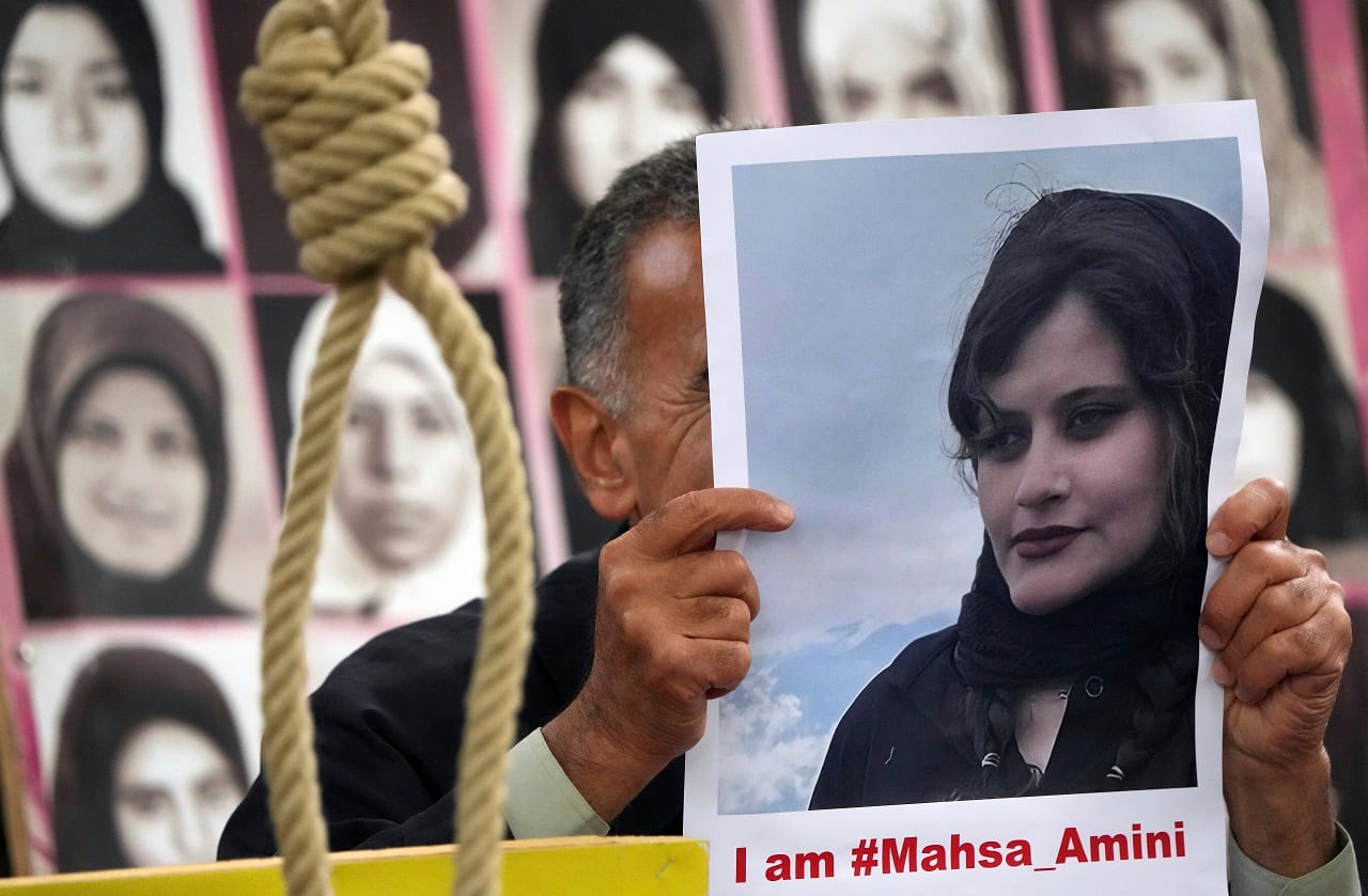 Exile Iranians of the National Council of Resistance of Iran gather in front of the embassy of Iran in Berlin, Germany, Tuesday, Sept. 20 (AP Photo)