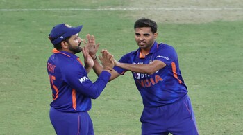 Rohit Sharma (left) and head coach Rahul Dravid tried out 29 players over the last 35 T20I matches, to handpick the team and prepare the think tank for every type of eventuality. (Image: AFP)