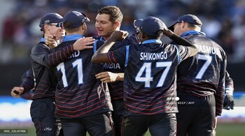 Namibia's J.J. Smit (C) and teammates celebrate the wicket of Sri Lanka's Chamika Karunaratne during the 2022 Twenty20 World Cup match at Kardinia Park in Geelong on October 16, 2022. (Image: AFP)