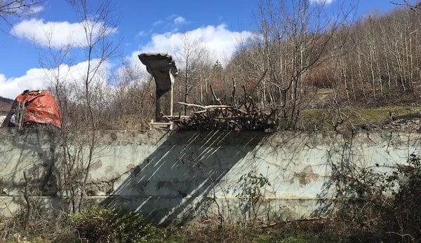 The abandoned swimming pool and diving board at Stan Terg in Kosovo. (Image: Bridget Storrie, Author provided)