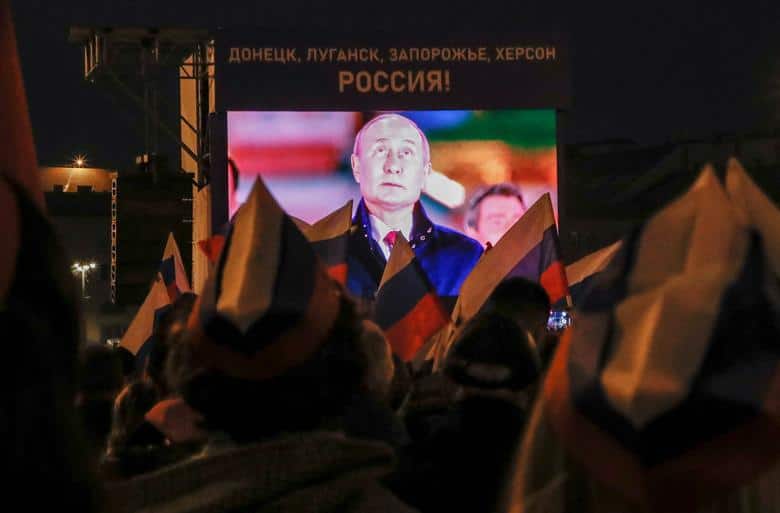 Russian annexation: Russian President Vladimir Putin is seen on a screen during a concert marking the declared annexation of the Russian-controlled territories of Ukraine's Donetsk, Luhansk, Kherson and Zaporizhzhia regions, after holding what Russian authorities called referendums in the occupied areas of Ukraine that were condemned by Kyiv and governments worldwide, near the Kremlin and Red Square in central Moscow, Russia, September 30. (Image: REUTERS/Stringer)