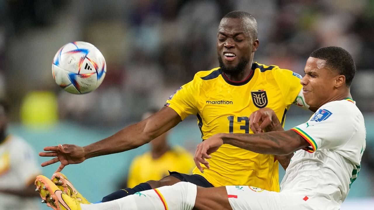 Senegal's Formose Mendy, right, and Ecuador's Enner Valencia challenge for the ball during the World Cup group A soccer match between Ecuador and Senegal, at the Khalifa International Stadium in Doha, Qatar. (Image: AP)
