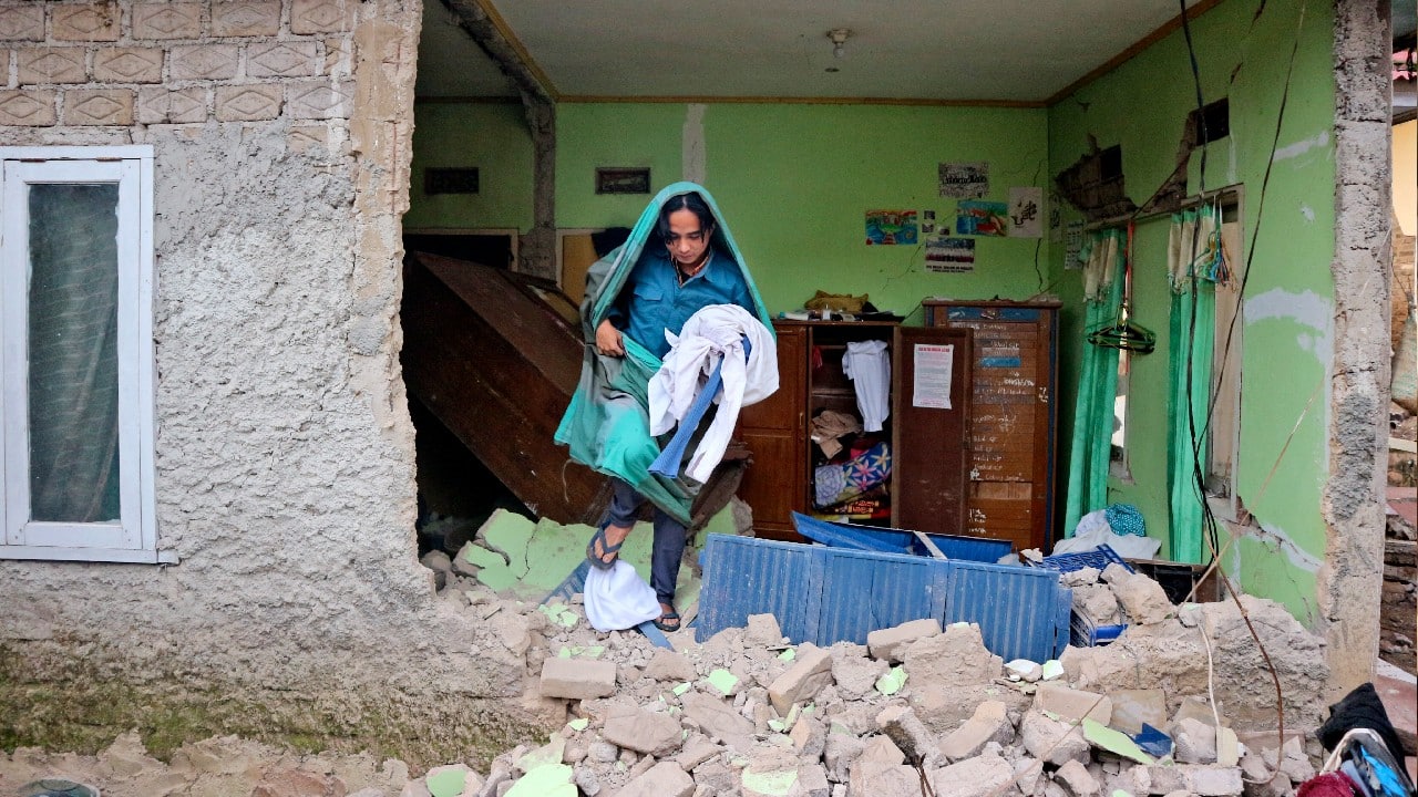 Terrified residents fled into the street, some covered in blood and debris. (Source: AP)