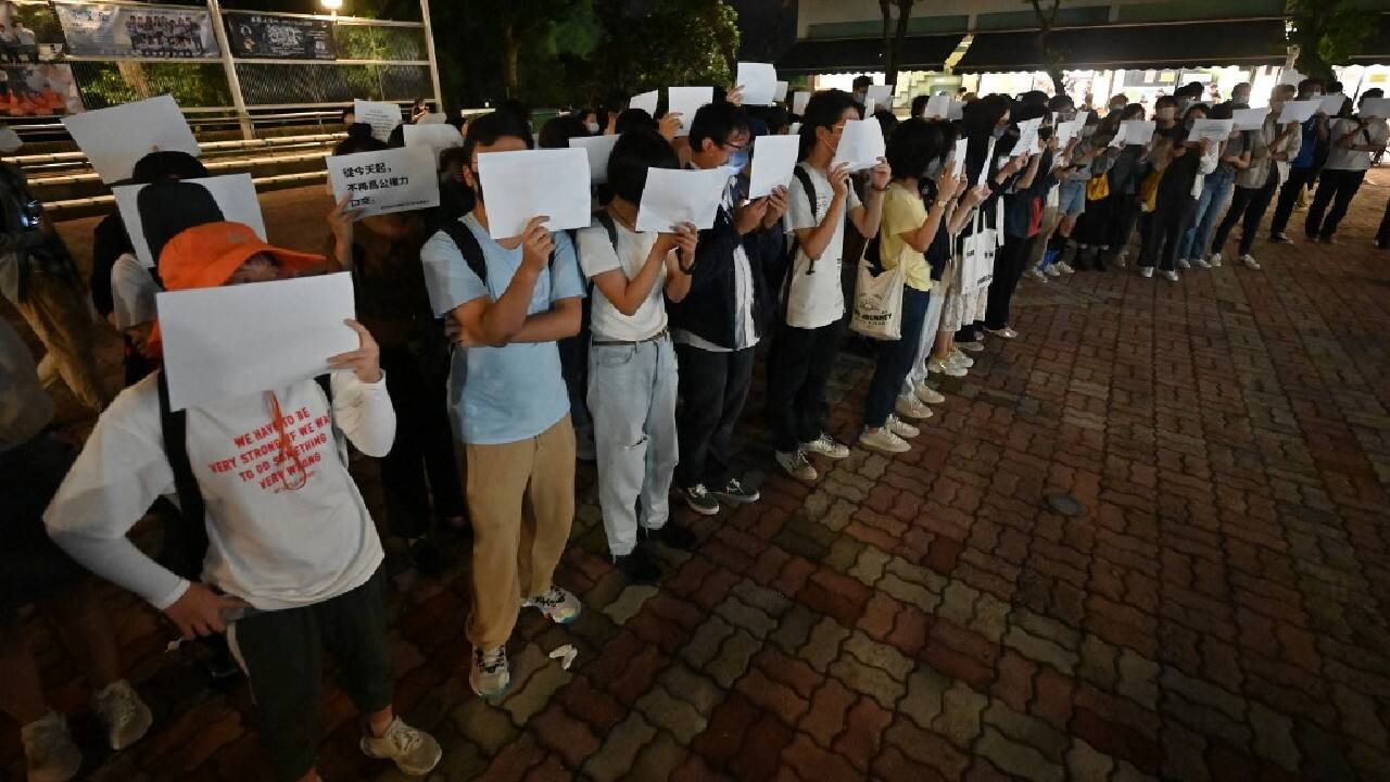 Elsewhere, some rallies did go ahead. In semi-autonomous Hong Kong, where mass democracy protests erupted in 2019, dozens gathered at the Chinese University to mourn the victims of the Urumqi fire. &quot;Don't look away. Don't forget,&quot; protesters shouted. (Image: AFP)