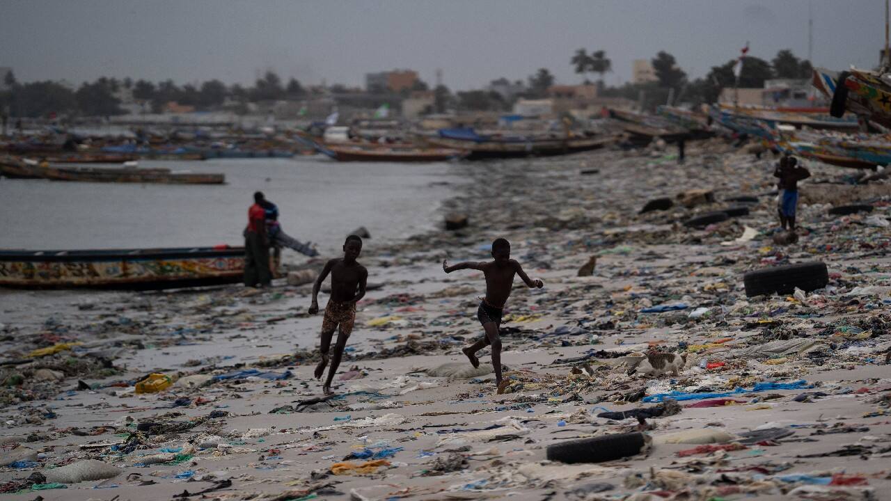 He founded an environmental association, called Clean Senegal, which raises awareness via education campaigns and encourages reuse and recycling. As he walks, kids on the beach shout: “Kankurang! Kankurang is coming!” (Image: AP)