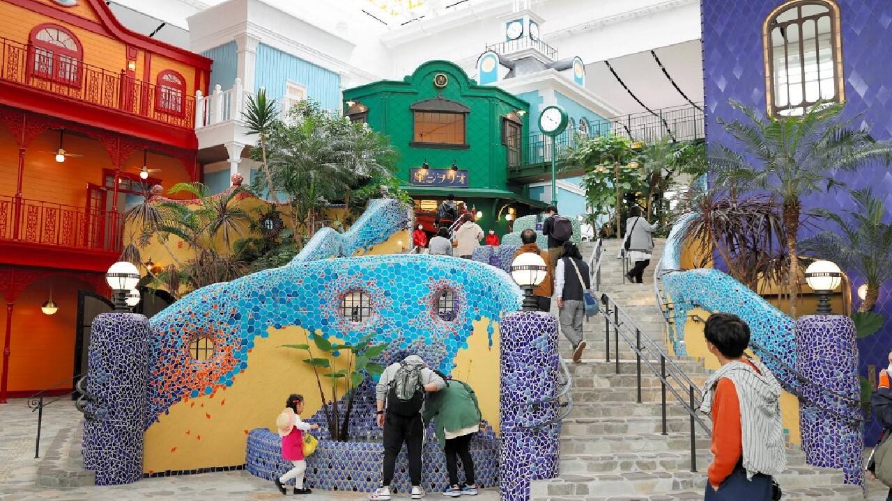 Now a fluffy Cat Bus, a life-sized No-Face and recreations of buildings from the films are ready for visitors less than a month after the country fully reopened its borders to foreign tourists. (Source: AFP)