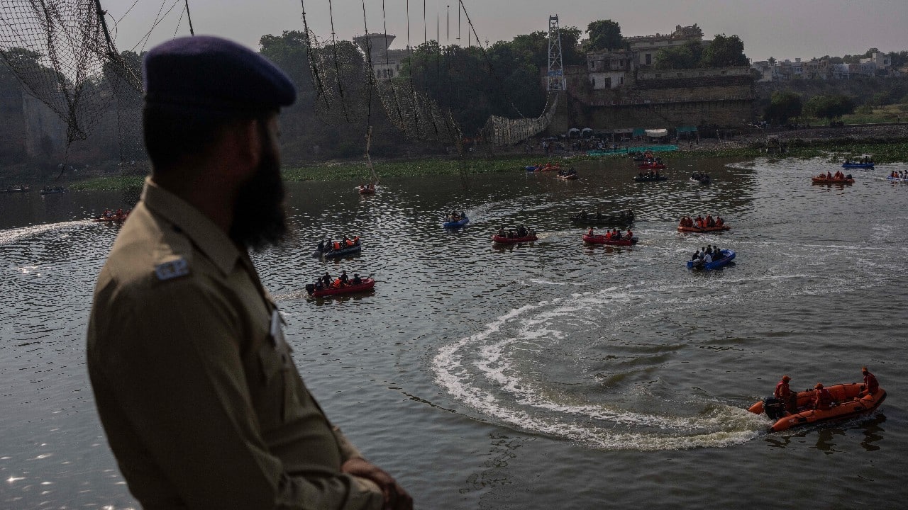 Gujarat government has constituted a five-member committee headed to probe the bridge collapse incident. nine persons including officials of Oreva, the company that renovated the bridge, ticket sellers and security men have been arrested for the Morbi bridge collapse. (Image: AP) (With inputs from agencies)