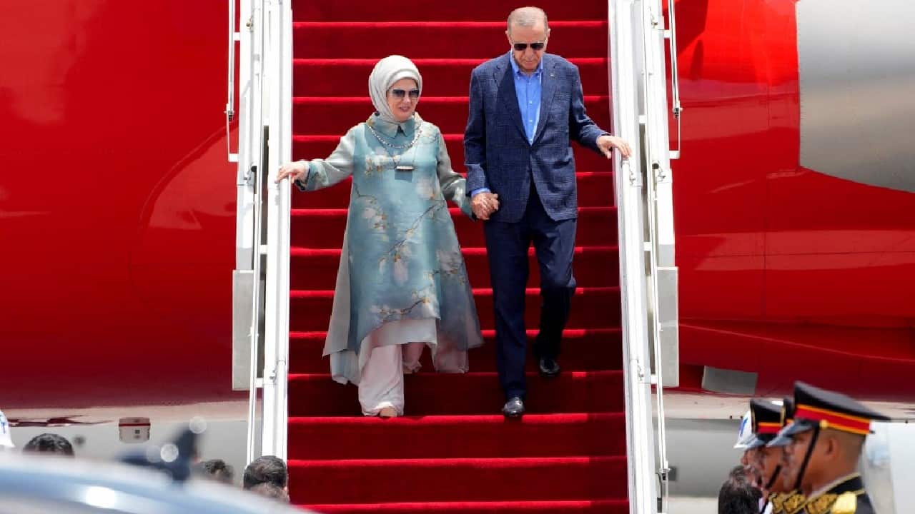 Turkey's President Recep Tayyip Erdogan and his wife Emine Erdogan arrive to attend the G20 Summit, at Ngurah Rai International airport in Denpasar on the Indonesian resort island of Bali on November 14. (Image: AFP)