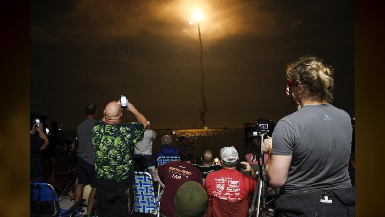 "I've been down here a couple of times already to watch this thing go up and have it canceled, so, this is like, whatever, the third trip down here for this, so I'm excited to see it go," said the network engineer. "I was too little for the Apollo missions, so ... I wanted to be here in person." (Image: AFP) "I've been down here a couple of times already to watch this thing go up and have it canceled, so, this is like, whatever, the third trip down here for this, so I'm excited to see it go," said the network engineer. "I was too little for the Apollo missions, so ... I wanted to be here in person." (Image: AFP)