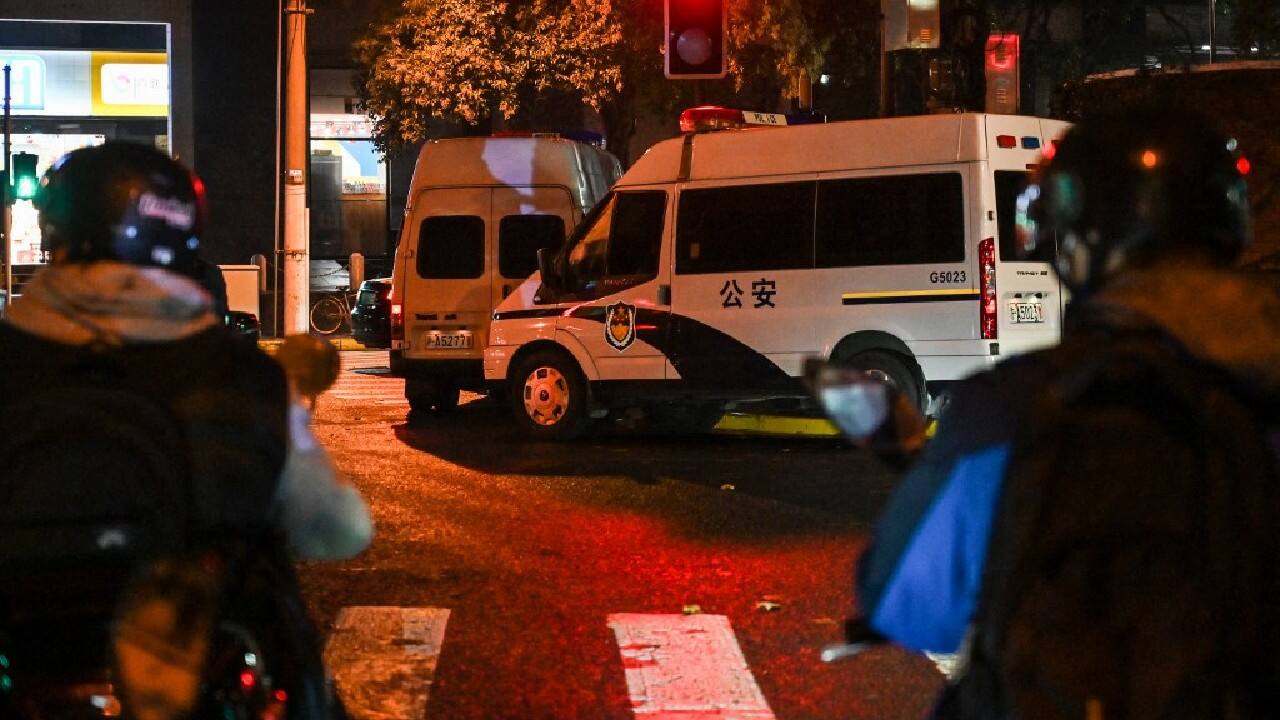 Small clusters of officers stood outside each metro exit. Throughout the day AFP journalists saw officers detaining four people, later releasing one, with a reporter counting 12 police cars within 100 metres along Wulumuqi street in Shanghai, the focal point of Sunday's rally. &quot;The atmosphere tonight is nervy. There are so many police around,&quot; a man in his early 30s told AFP as evening fell. (Image: AFP)