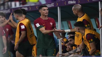 Portugal's Cristiano Ronaldo greets teammates in the bench after being replaced by Joao Mario during a World Cup group H soccer match against Ghana at the Stadium 974 in Doha, Qatar, Thursday, Nov. 24, 2022. (AP Photo/Manu Fernandez)