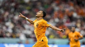 Cody Gakpo of the Netherlands celebrates after scoring his side's opening goal during the World Cup group A soccer match between the Netherlands and Qatar, at the Al Bayt Stadium in Al Khor , Qatar, Tuesday, Nov. 29, 2022. (AP Photo/Moises Castillo)
