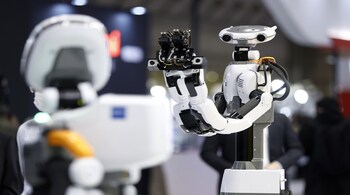 A Kawada Robotics Co. Nextage Fillie robot during a demonstration at the International Robot Exhibition in Tokyo, Japan, on Wednesday, March 9, 2022. The expo at Tokyo Big Sight runs through March 12.