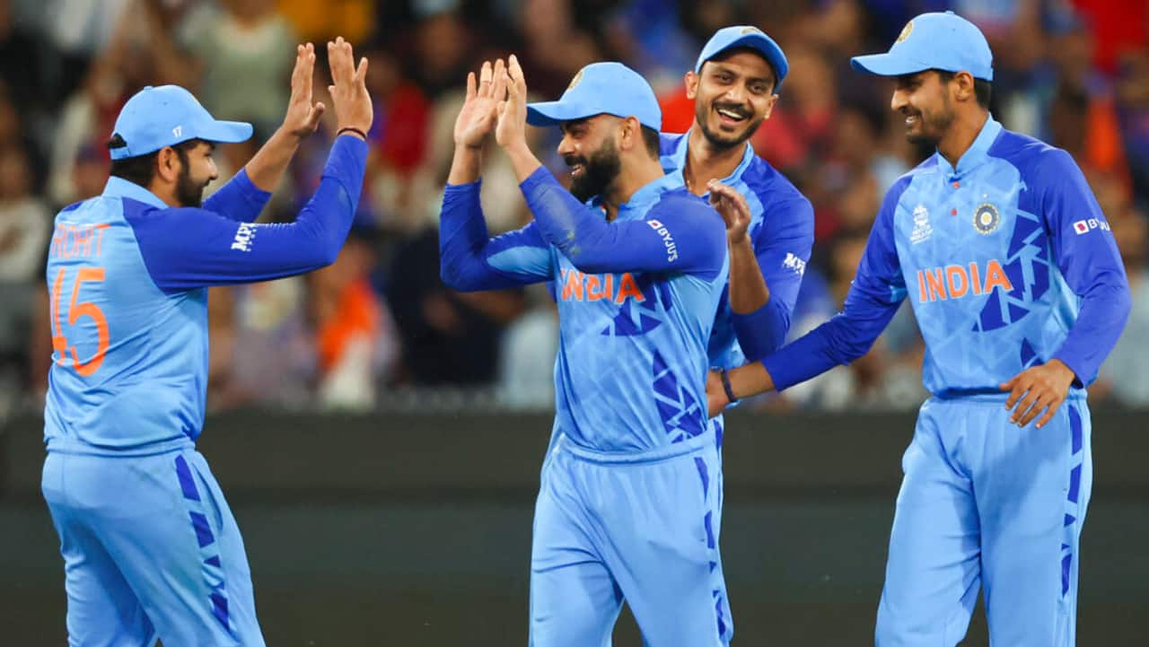 Virat Kohli, second left, is congratulated by teammates after taking a catch to dismiss Zimbabwe's Wesley Madhevere during the T20 World Cup cricket match between India and Zimbabwe in Melbourne, Australia.
