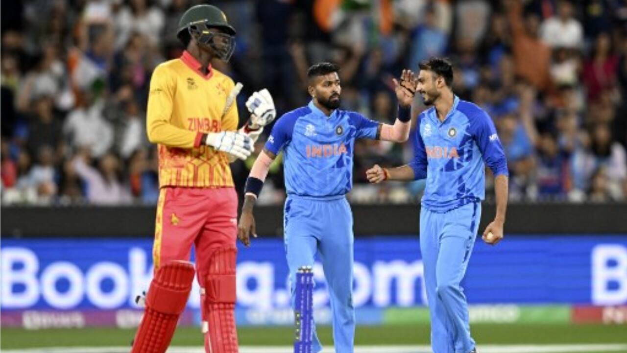 Axar Patel (R) celebrates the last wicket of Zimbabwe's Tendai Chatara with Hardik Pandya (C) during the ICC men's Twenty20 World Cup 2022 cricket match between India and Zimbabwe at Melbourne Cricket Ground (MCG) on November 6.