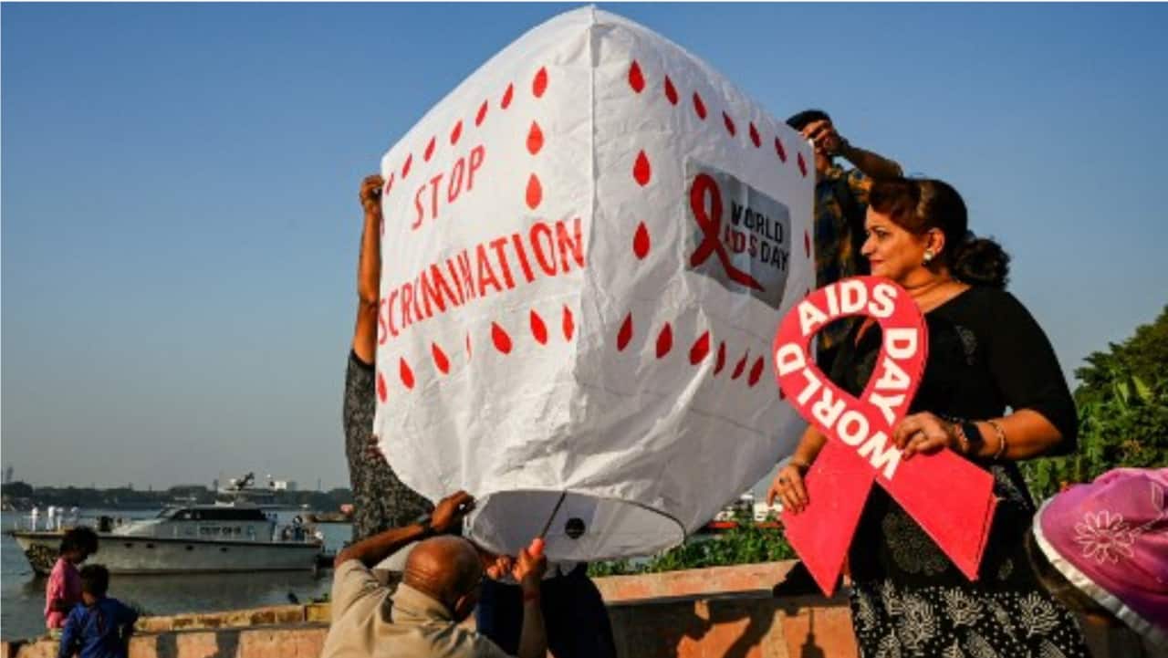 Social activists prepare to release a traditional hot air balloon to create awareness about HIV AIDS on the eve of ‘World AIDS Day’ in Kolkata on Wednesday.