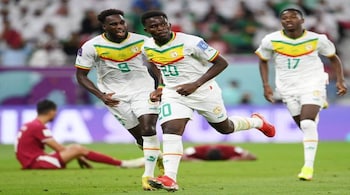 Senegal players celebrate after scoring third goal against Qatar in the group fixture