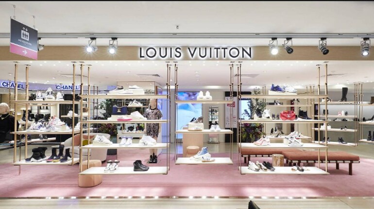 French luxury brand Louis Vuitton banner seen outside its retail store in  the Soho neighborhood of New York, NY, February 23, 2021. British and  Italian Fashion Week shows are underway in Europe