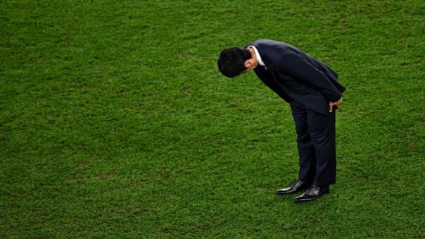 Viral photo: Japan wins hearts as coach bows after FIFA 2022 exit, fans clean up stadium