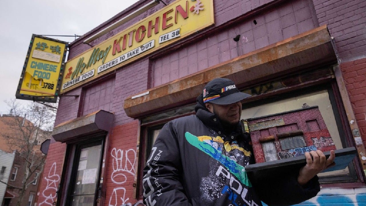 One of his recent creations is a modest Chinese restaurant with a battered yellow sign and with its red-and-mauve brick walls covered with graffiti. Standing outside the restaurant -- the real one -- Cortes, sporting a black jacket and a baseball cap over his round face -- smiles as he tells how New York rapper Joell Ortiz, who grew up in the neighborhood, insisted on buying the model, saying, &quot;Yo, I need that.&quot; The price? &quot;Ten thousand dollars,&quot; Cortes says, adding that &quot;the first piece I sold was like $30, and I was so happy that I got $30.&quot; (Image: AFP)