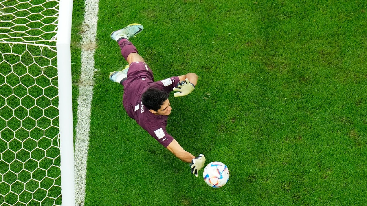 Morocco's goalkeeper Yassine Bounou saves a penalty kick during the World Cup round of 16 soccer match between Morocco and Spain, at the Education City Stadium in Al Rayyan, Qatar. (Source: AP)