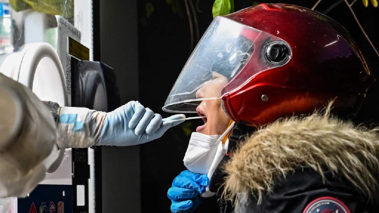 At the first hospital's ICU on December 23, the cleaner told AFP it was mostly elderly people who were dying. Gesturing to a space where a bed had been a little while before, he said: &quot;Look, that old man in there died just now.&quot; (Image: AFP)