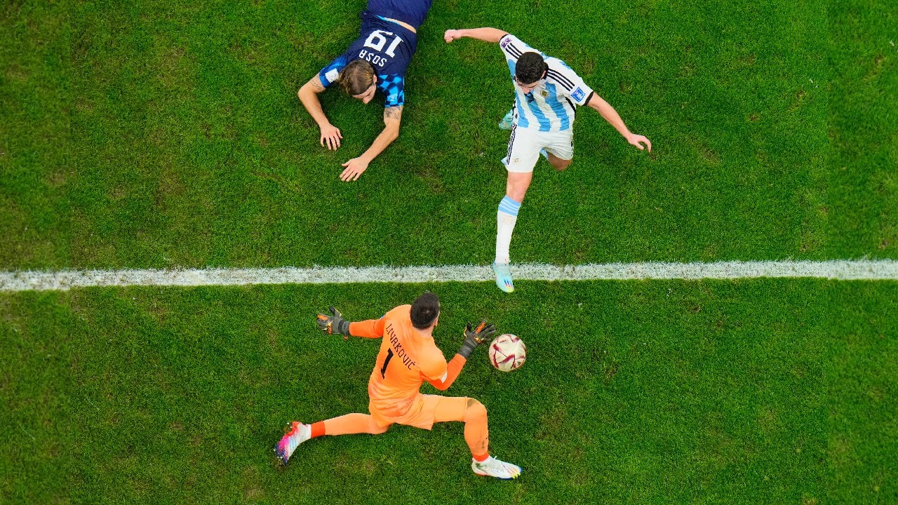 Argentina's Julian Alvarez scores his side's second goal passing Croatia's goalkeeper Dominik Livakovic during the World Cup semifinal soccer match between Argentina and Croatia at the Lusail Stadium in Lusail, Qatar. (Source: AP)