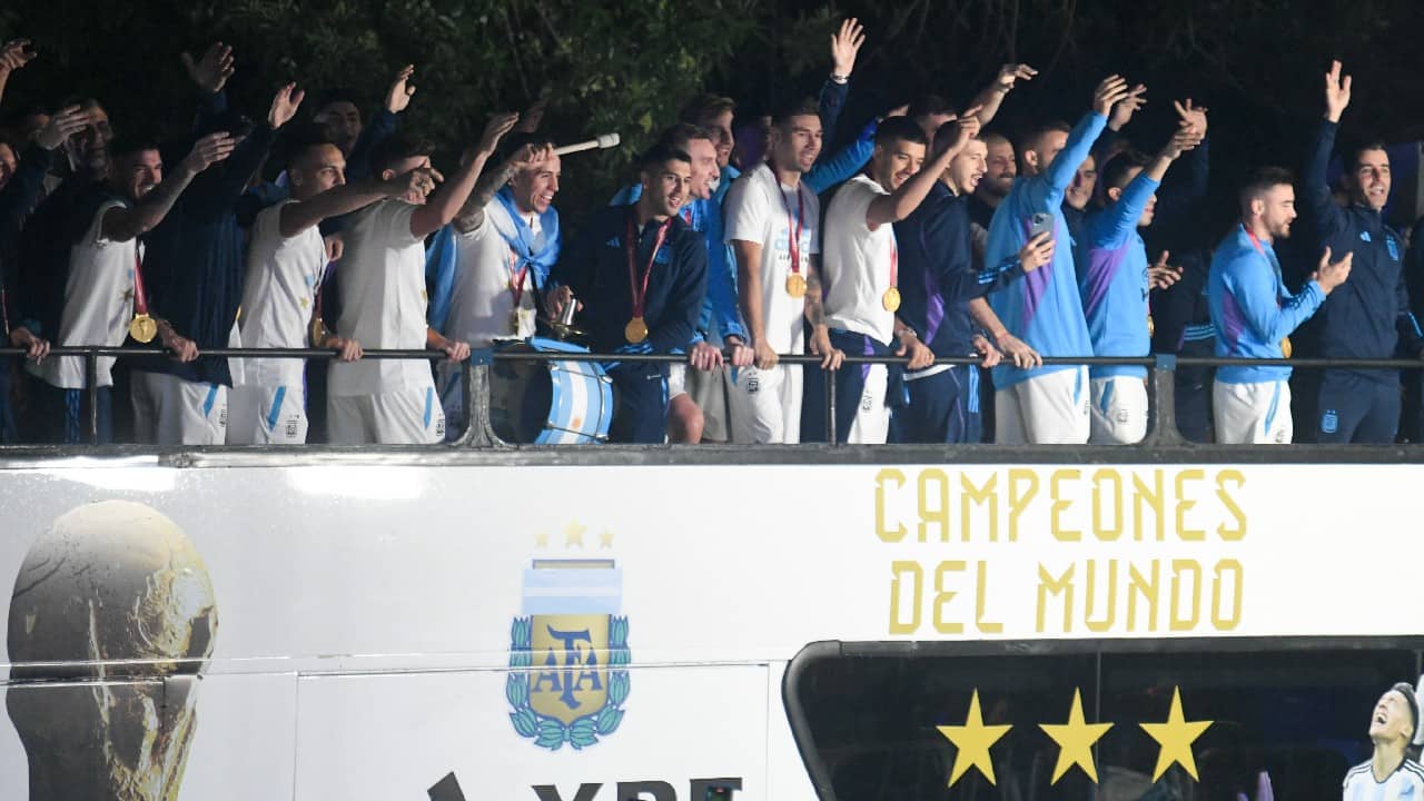 The newly crowned champions of the world boarded an open top bus and several, including Messi, could be seen singing the words to “Muchachos” while they waited for everyone to get on heading to the headquarters of the Argentine Football Association. (Image: AP)