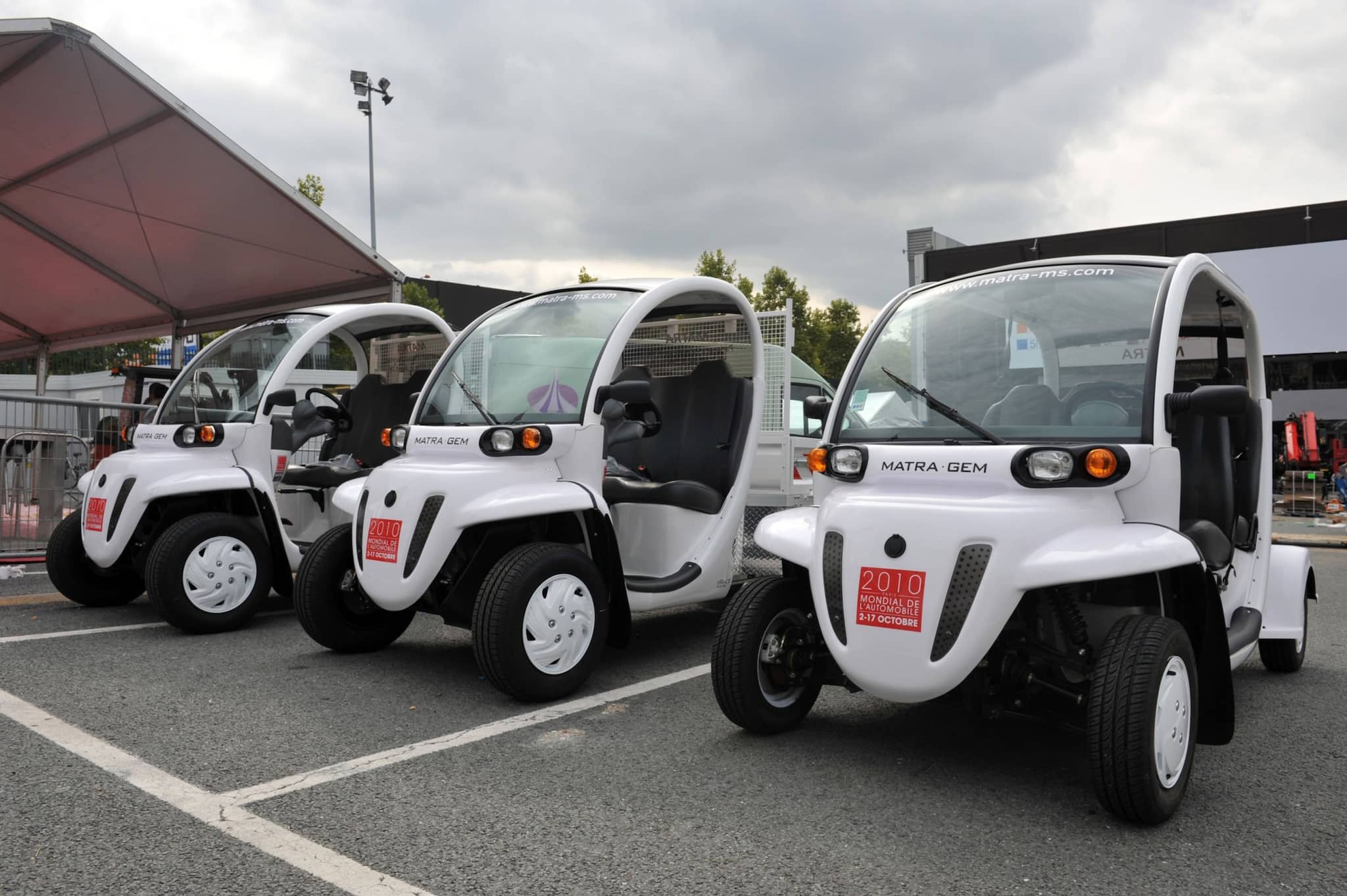 GEM e4 electric carts at the 2010 Paris Motor Show. - Bloomberg