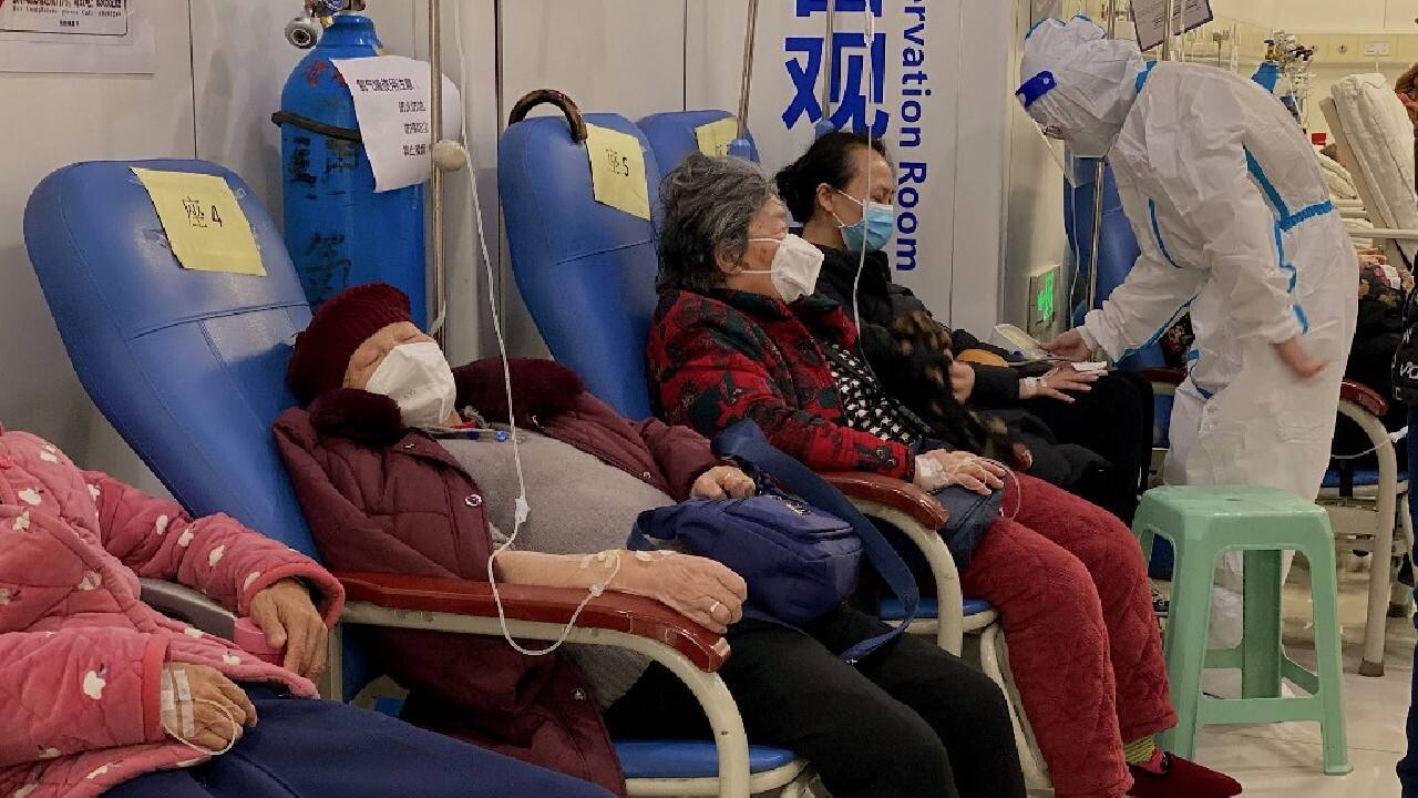 In a nearby room, about 40 mostly elderly and middle-aged patients sat on sofas and lay on beds receiving IV drips, some coughing. A nurse said they all had Covid. In an intensive care unit next door, three people lay on beds attached to respirators and heart monitoring equipment. (Image: AFP)