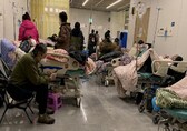 Caring with COVID-19: Infected doctors battle China virus surge