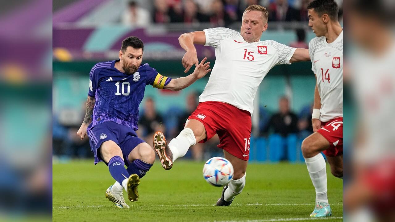 Poland's Kamil Glik, center, tries to block a shot from Argentina's Lionel Messi during the World Cup group C soccer match between Poland and Argentina at the Stadium 974 in Doha, Qatar. (Source: AP)
