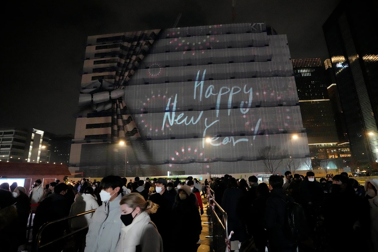People gather before the New Year's countdown event at downtown Seoul, South Korea, Saturday, Dec. 31, 2022. (AP Photo/Lee Jin-man)