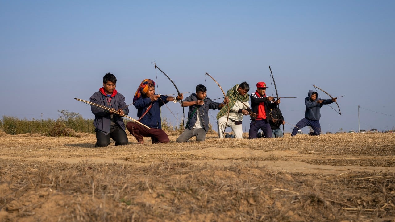 Thirty archers armed with bamboo bows and arrows sit on a platform awaiting instruction. Then they take aim at a straw cylinder 60 feet away. They each have 34 arrows to shoot in four minutes. They release one arrow after another, their movements languid and practiced. The next round of the competition soon follows, when the archers must shoot 24 arrows in three minutes. (Image: AP) Thirty archers armed with bamboo bows and arrows sit on a platform awaiting instruction. Then they take aim at a straw cylinder 60 feet away. They each have 34 arrows to shoot in four minutes. They release one arrow after another, their movements languid and practiced. The next round of the competition soon follows, when the archers must shoot 24 arrows in three minutes. (Image: AP)