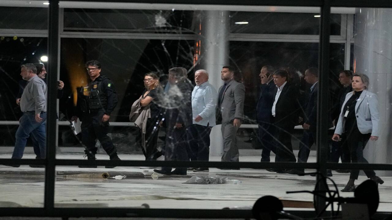 Brazil's President Luiz Inacio Lula da Silva, center, inspects the damage at Planalto Palace after it was stormed by supporters of Brazil's former President Jair Bolsonaro in Brasilia, Brazil. (Image: AP)