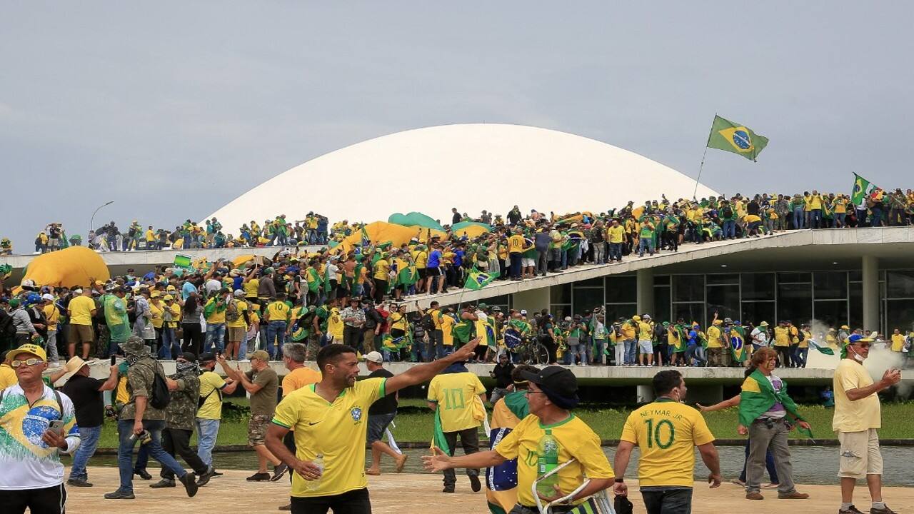 Hundreds of supporters of Brazil's far-right ex-president Jair Bolsonaro broke through police barricades and stormed into Congress, the presidential palace and the Supreme Court on January 8, in a dramatic protest against President Luiz Inacio Lula da Silva's inauguration last week. (Image: AFP)