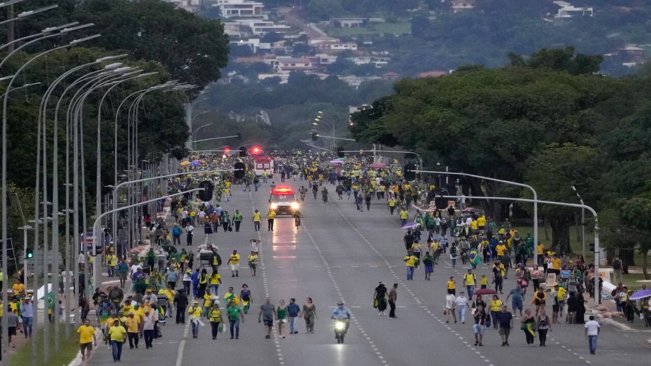 Protesters, supporters of Brazil's former President Jair Bolsonaro, leave the ministries' esplanade after a massive protest in Brasilia. The protesters who refuse to accept Bolsonaro´s election defeat stormed Congress, the Supreme Court and presidential palace in the capital, a week after the inauguration of his rival, President Luiz Inacio Lula da Silva. (Image: AP)