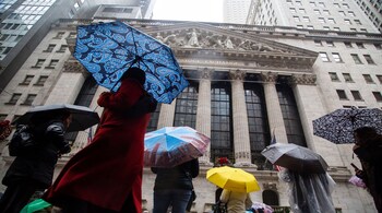 Pedestrians pass in front of the New York Stock Exchange (NYSE) in New York, US, on Tuesday, Jan. 3, 2023. US stocks fell as losses in Apple Inc. and Tesla Inc. weighed on the S&amp;P 500 and the tech-heavy Nasdaq 100. Photographer: Michael Nagle/Bloomberg