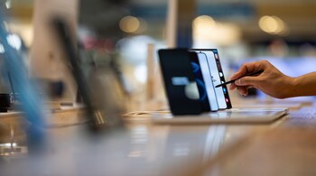 A customer tries out a Samsung Electronics Co. Galaxy S22 Ultra smartphone at the company's D'light flagship store in Seoul, South Korea, on Tuesday, July 5, 2022. Samsung Electronics will releases its preliminary fourth quarter earnings on July 7. Photographer: SeongJoon Cho/Bloomberg