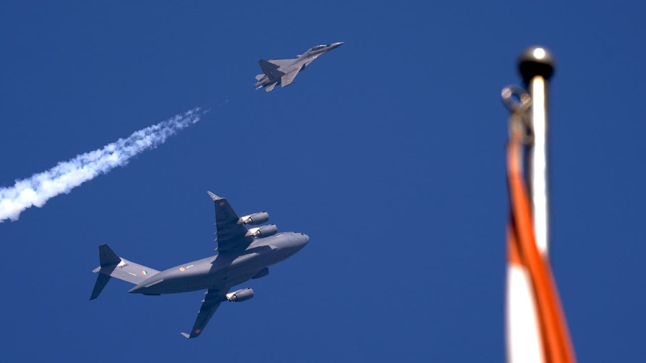 Indian Air Force C17 Globemaster, bottom, with fighter aircraft Su30 fly past during Republic Day parade rehearsals, in New Delhi. (Image: AP)