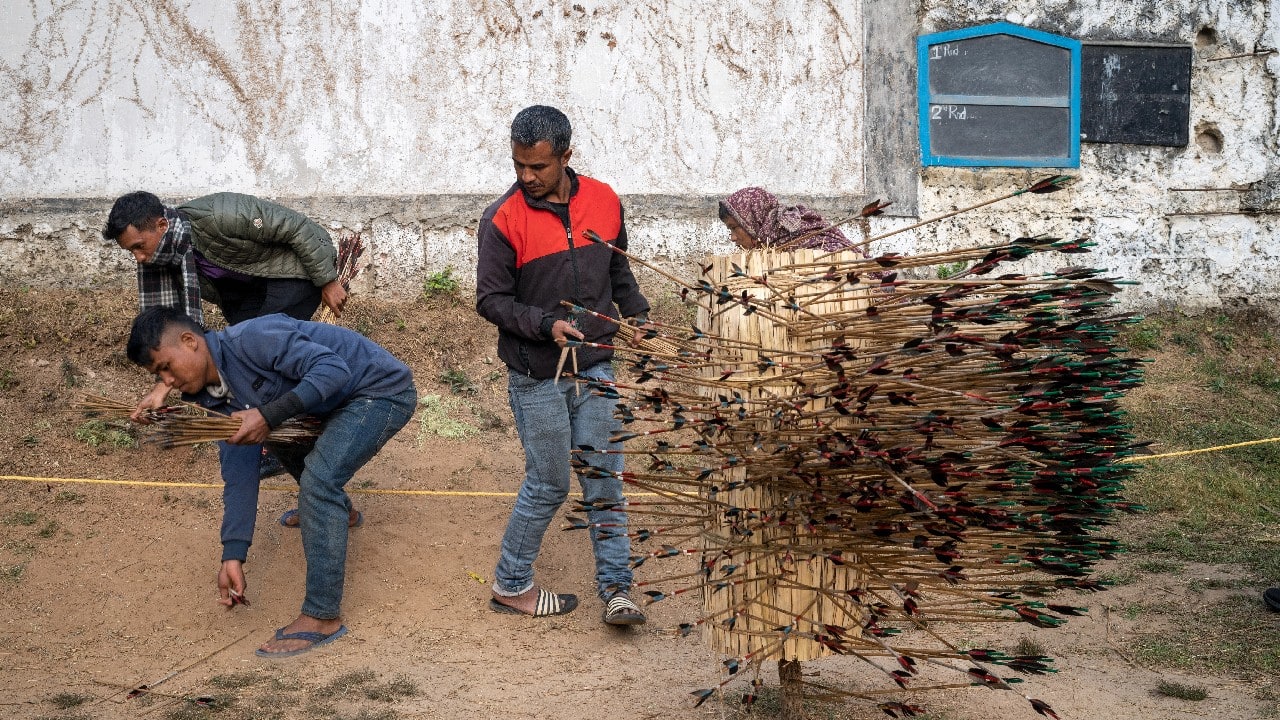 In villages across the state, a more traditional form of archery is practiced. The archers have to hit a much smaller target mounted on a stick and a form of poetry called “phawar” — four lines composed on the spot — is used to rattle opponents. (Image: AP) In villages across the state, a more traditional form of archery is practiced. The archers have to hit a much smaller target mounted on a stick and a form of poetry called “phawar” — four lines composed on the spot — is used to rattle opponents. (Image: AP)